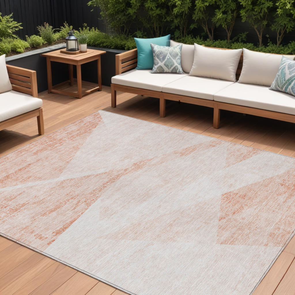 10' X 14' Salmon Peach And Ivory Abstract Washable Indoor Outdoor Area Rug