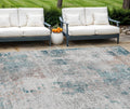 10' X 14' Teal Blue Beige And Copper Abstract Washable Indoor Outdoor Area Rug