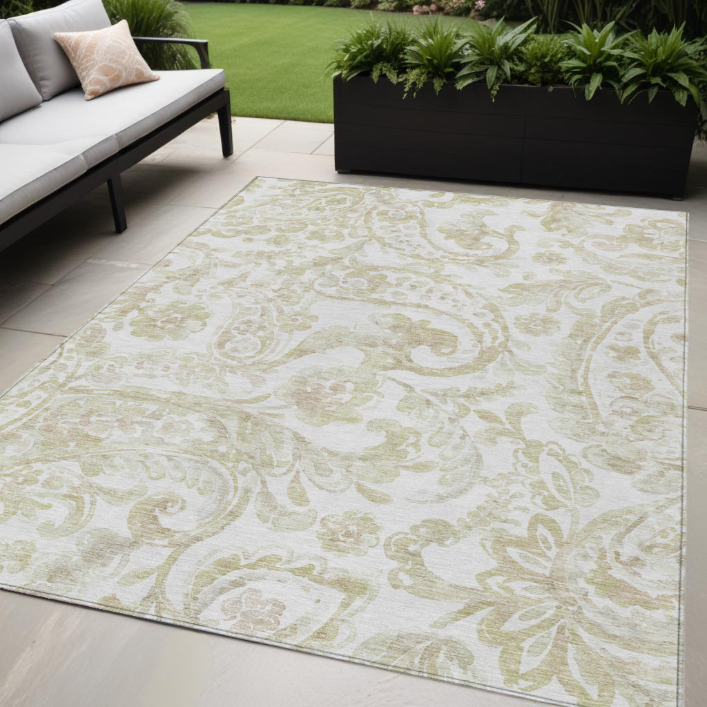 5' X 8' Beige Tan And Ivory Paisley Washable Indoor Outdoor Area Rug