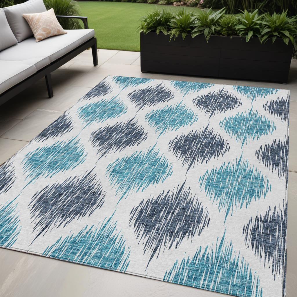 5' X 8' Teal Blue And Ivory Ikat Washable Indoor Outdoor Area Rug