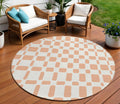 8' Peach And Beige Round Geometric Washable Indoor Outdoor Area Rug