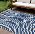 9' X 12' Blue And Ivory Chevron Washable Indoor Outdoor Area Rug
