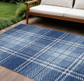 9' X 12' Navy Blue Black And Ivory Plaid Washable Indoor Outdoor Area Rug