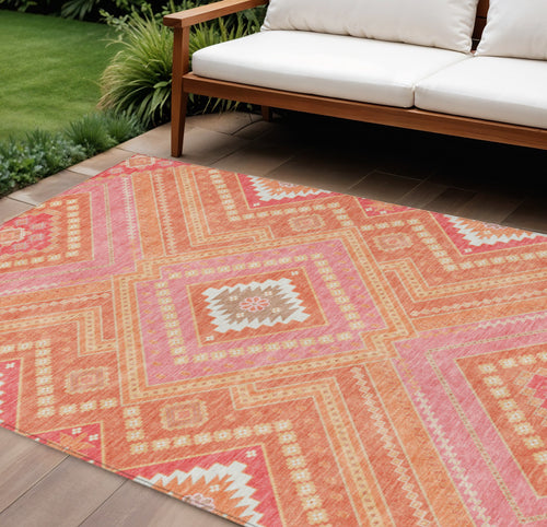 10' X 14' Coral Pink And Ivory Tribal Washable Indoor Outdoor Area Rug