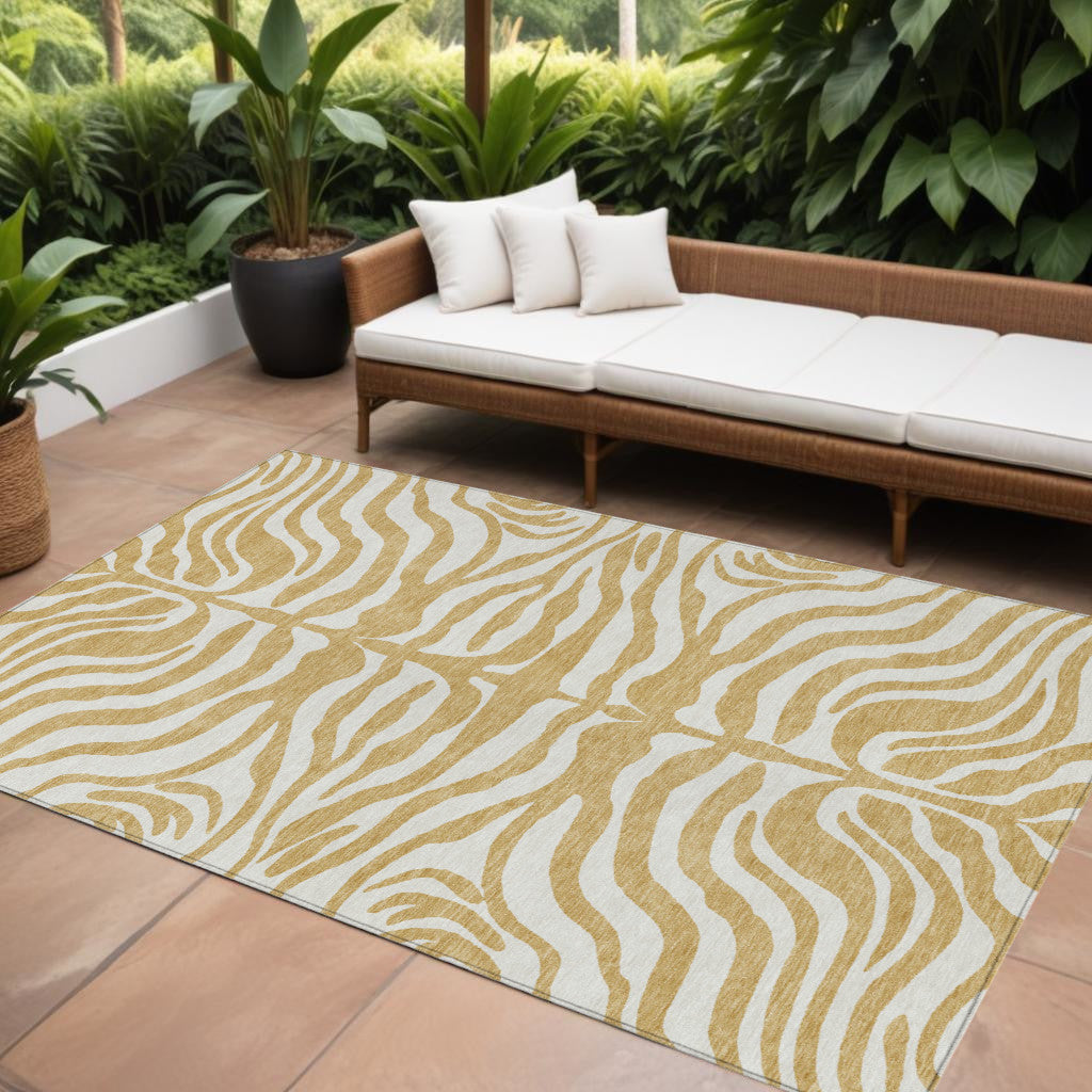 9' X 12' Gold And Ivory Animal Print Washable Indoor Outdoor Area Rug