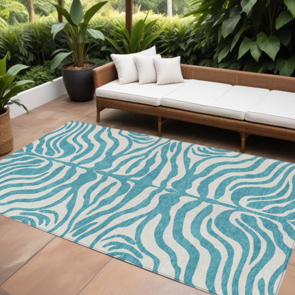 9' X 12' Teal Blue And Ivory Animal Print Washable Indoor Outdoor Area Rug