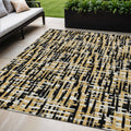 5' X 8' Black Gold And Ivory Abstract Washable Indoor Outdoor Area Rug