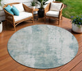 8 Turquoise And Ivory Round Abstract Washable Indoor Outdoor Area Rug