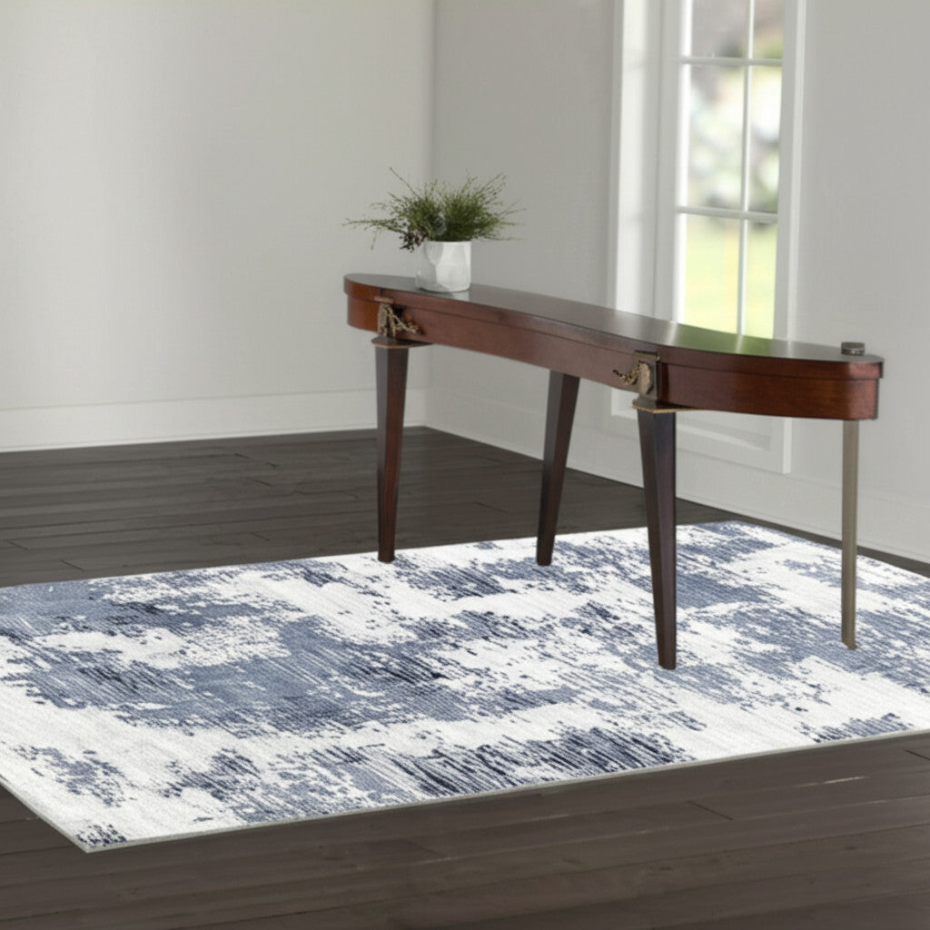 4' X 6' Blue And Ivory Abstract Hand Tufted Area Rug