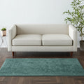 5' X 8' Green And White Hand Woven Area Rug