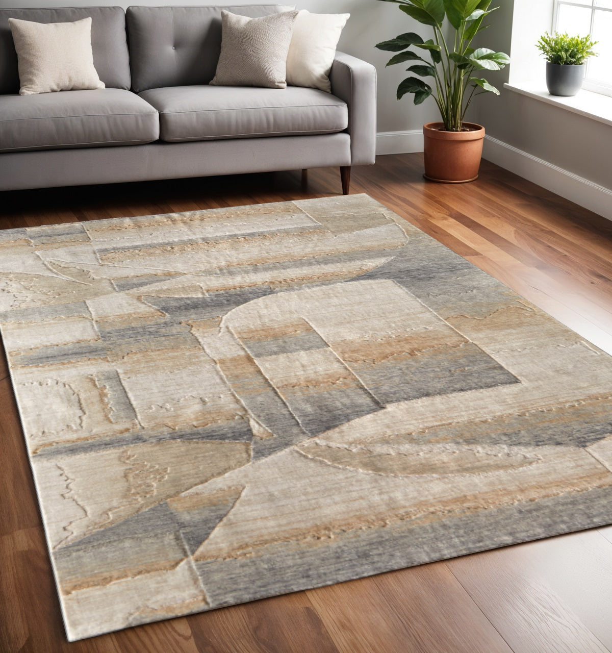 5' X 8' Tan Brown And Gray Abstract Area Rug