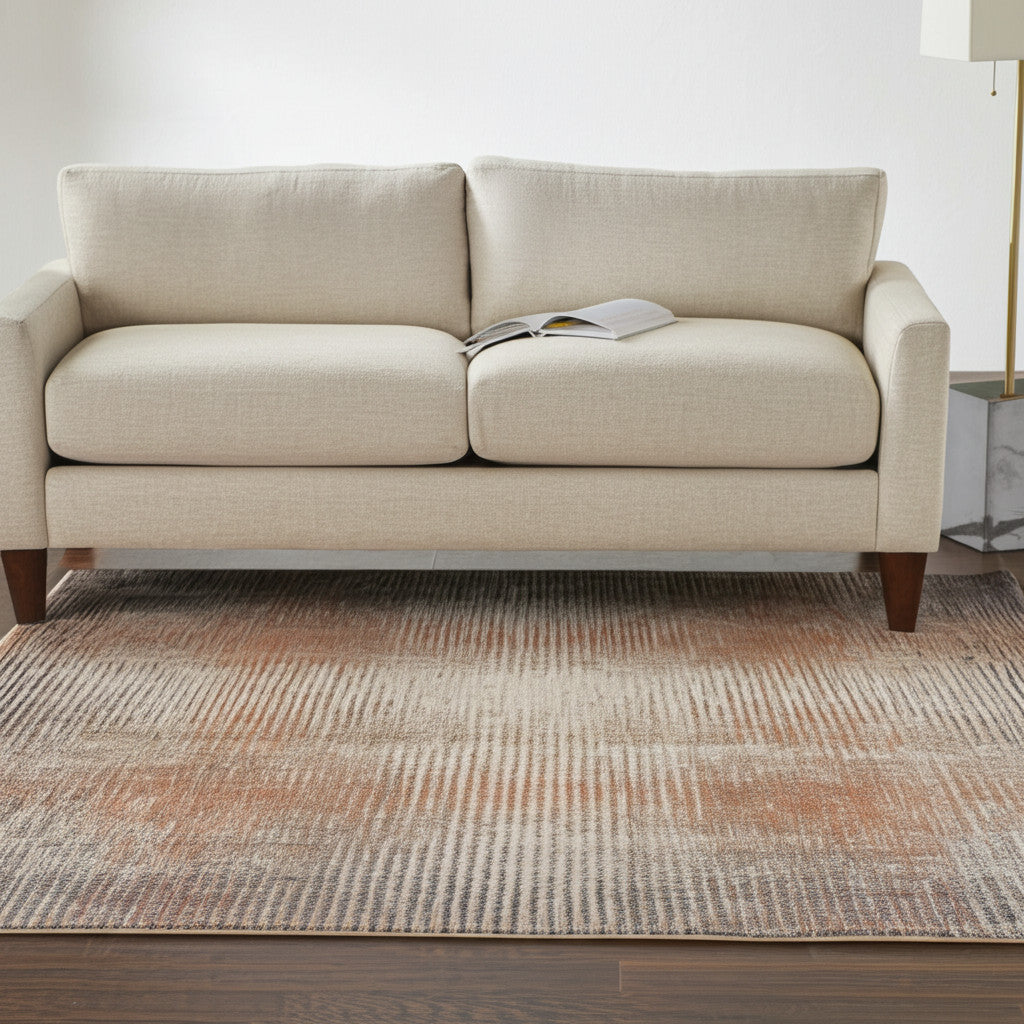 5' X 8' Ivory Taupe And Pink Abstract Area Rug