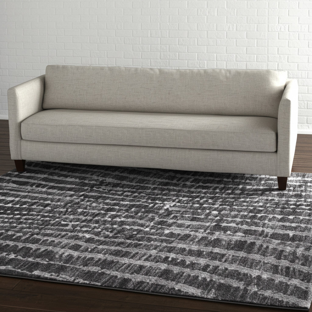 5' X 8' Black Gray And Ivory Abstract Area Rug