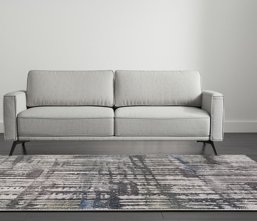 5' X 8' Gray Black And Ivory Abstract Distressed Area Rug