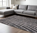 7' X 10' Black Gray And Ivory Abstract Area Rug