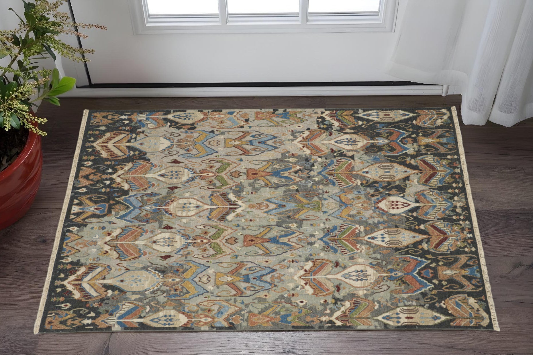 9' X 13' Taupe Tan And Orange Ikat Hand Knotted Area Rug With Fringe