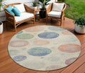 8 Ivory And Peach Round Geometric Washable Indoor Outdoor Area Rug