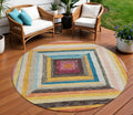 8 Amber Pink And Teal Blue Round Geometric Washable Indoor Outdoor Area Rug