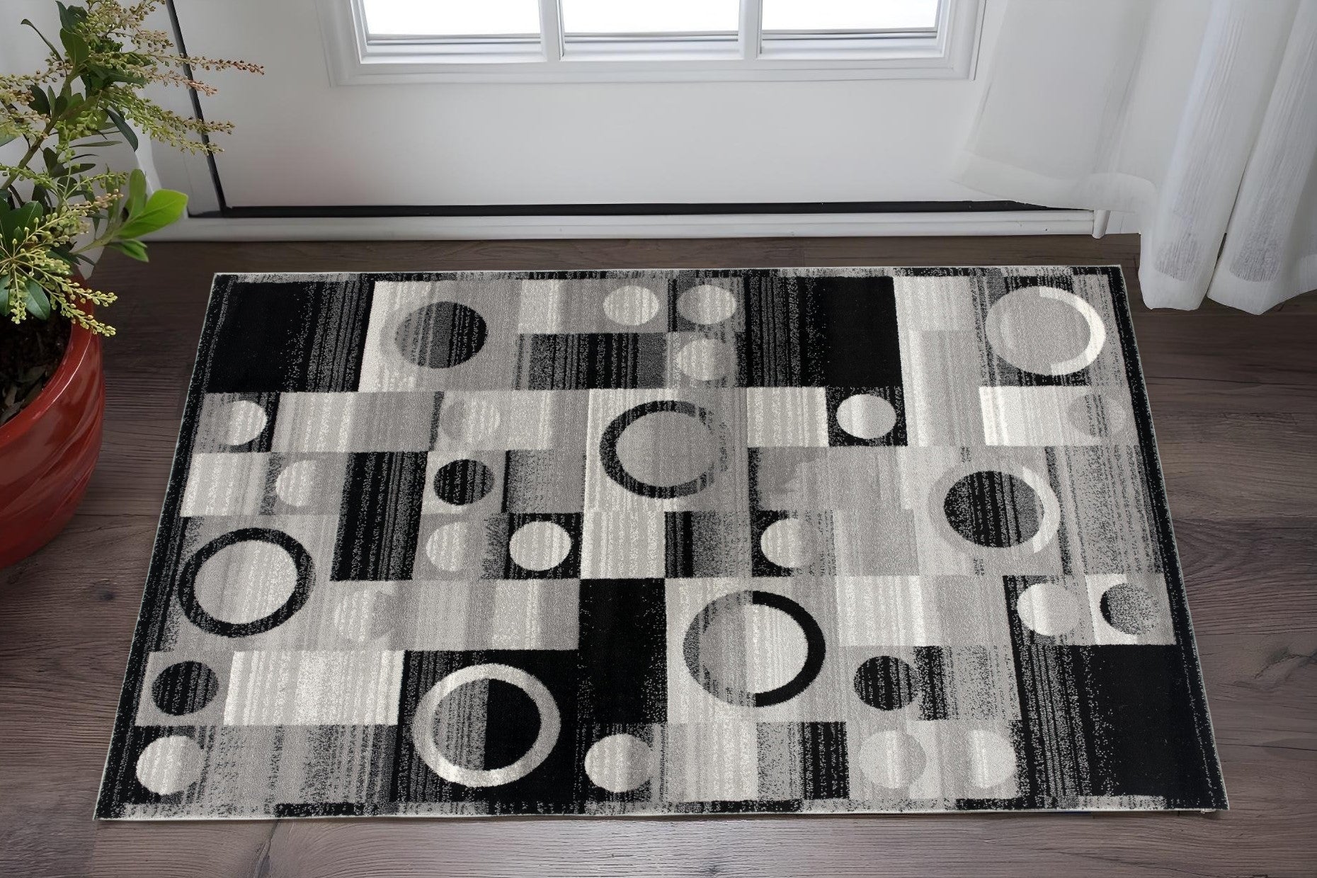 2 X 5 Black And Gray Geometric Area Rug