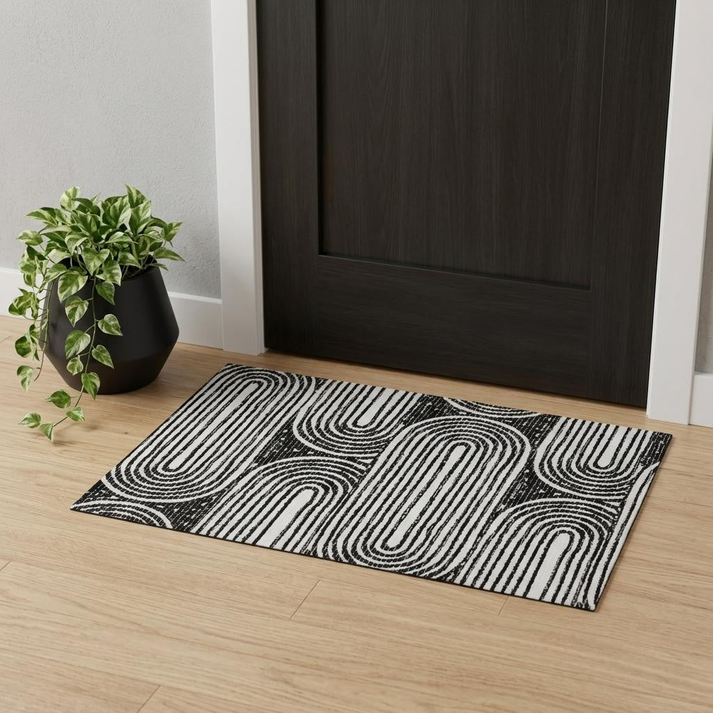3 X 5 Black And Ivory Geometric Distressed Washable Area Rug With UV Protection