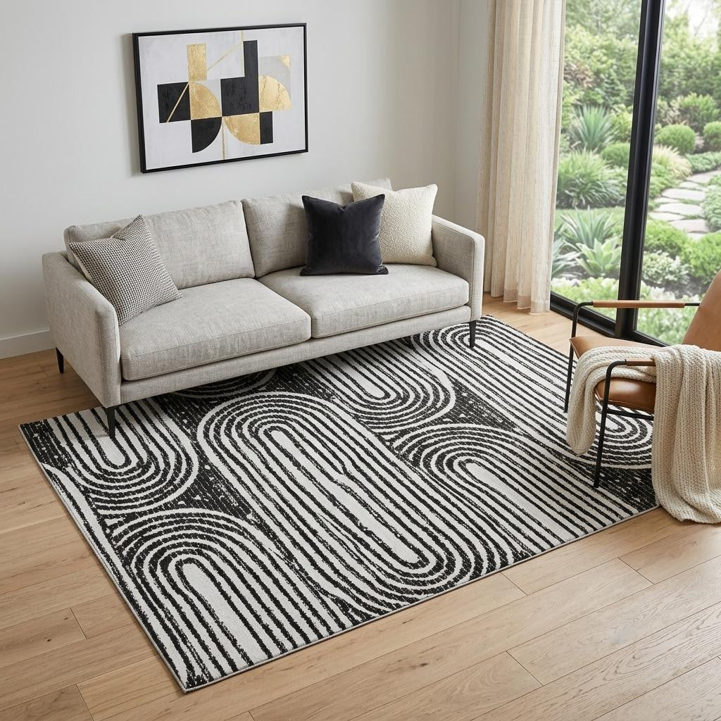 5 X 8 Black And Ivory Geometric Distressed Washable Area Rug With UV Protection