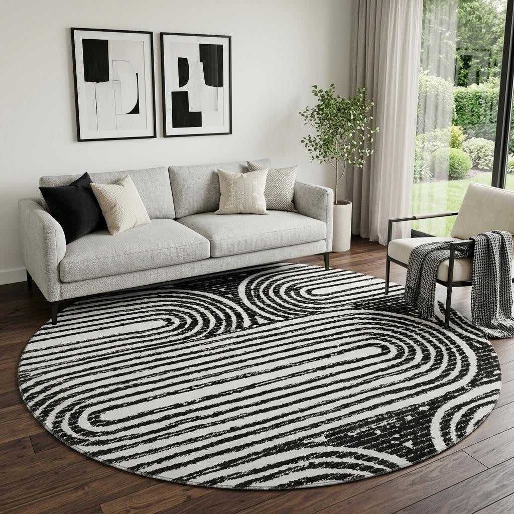 8 Black And Ivory Geometric Distressed Washable Round Rug With UV Protection