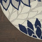 HomeRoots Ivory/Navy 100% Polypropylene 8’ Round Ivory and Navy Indoor Outdoor Area Rug