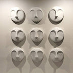 HomeRoots Round Matte White Glaze Finish Ceramic Face Wall Sculpture