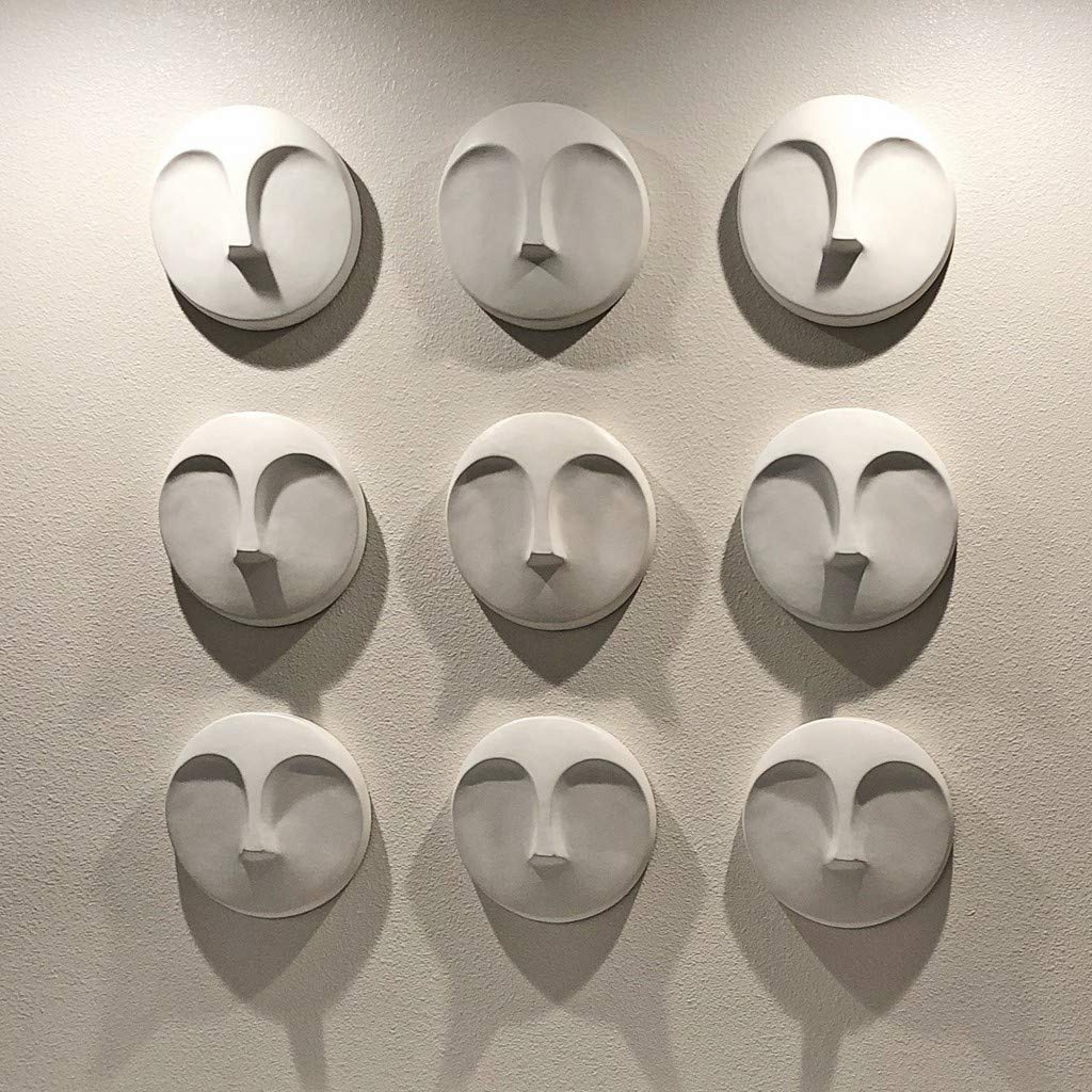 HomeRoots Round Matte White Glaze Finish Ceramic Face Wall Sculpture