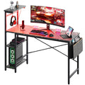 Bestier Gaming Desk with LED Lights, 51.3 Inch Computer Desk with 4 Tiers Reversible Shelves, Gamer Desk with Side Storage Bag, 