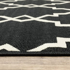 HomeRoots Polypropylene 8’ Round Black and Ivory Trellis Indoor Outdoor Area Rug