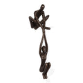 Danya B. ZD16169 Contemporary Metal Shelf Dcor  Bronze Sculpture  Man Lifting Woman from Ledge