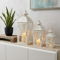 Set of Three White And Clear Filigree Scroll Metal And Glass Tabletop Lantern Candle Holders