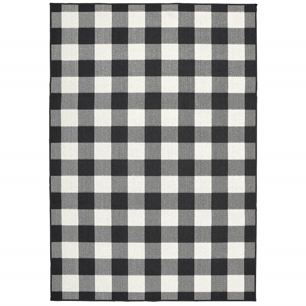 HomeRoots Polypropylene 2’x4’ Black and Ivory Gingham Indoor Outdoor Area Rug