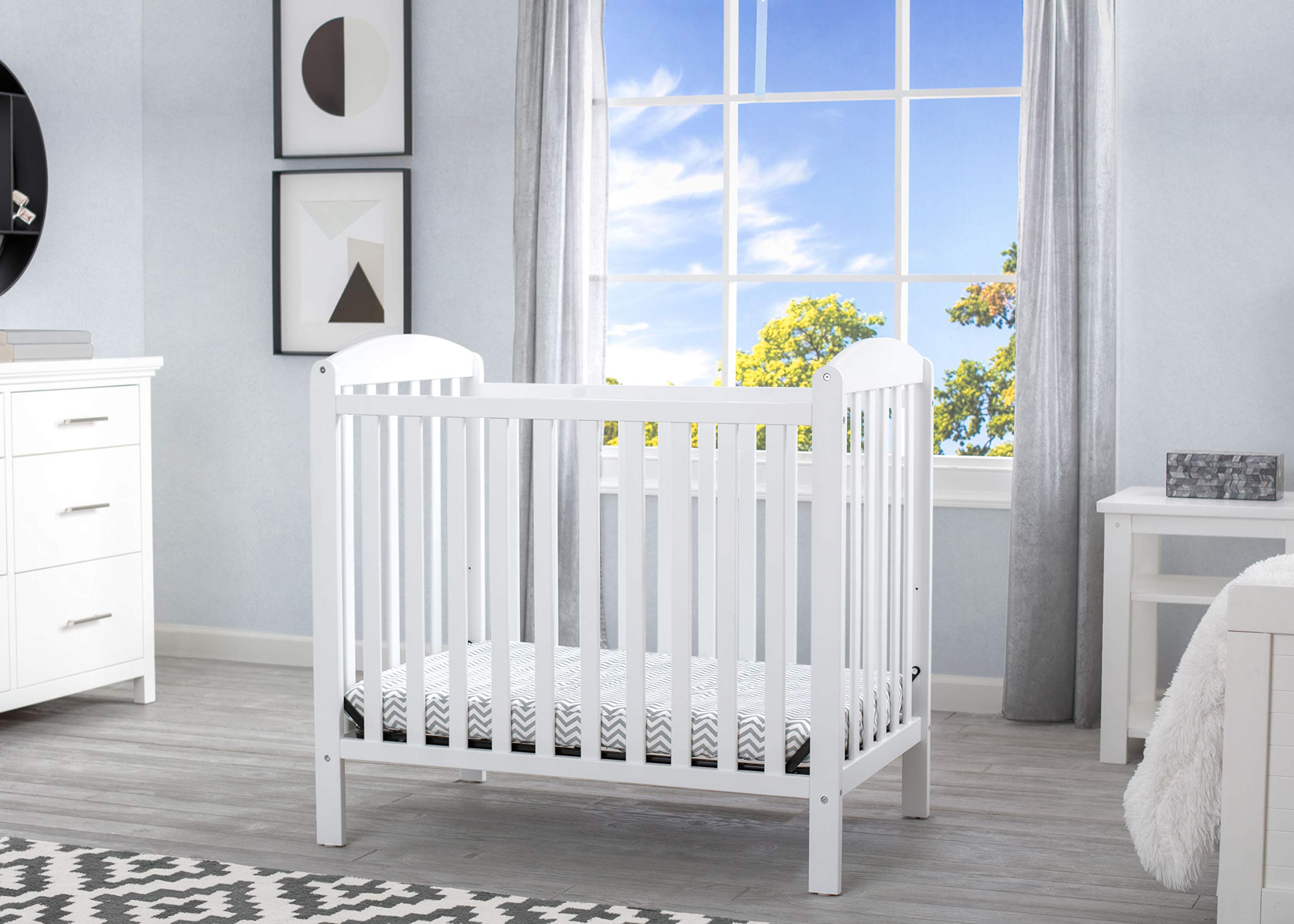 Delta Children Emery Mini Convertible Baby Crib With 2.75-Inch Mattress, Bianca White