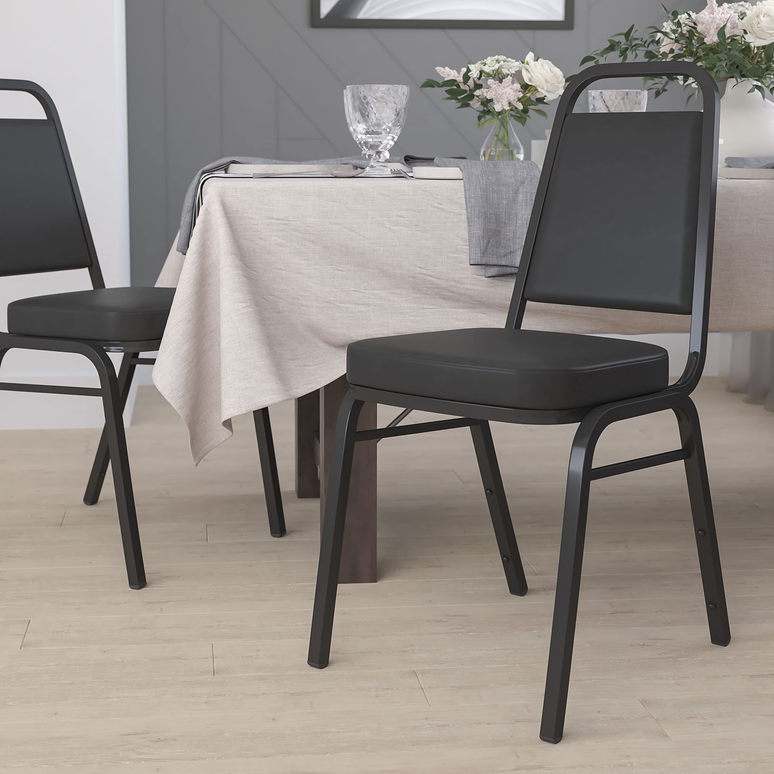 Flash Furniture HERCULES Series Trapezoidal Back Stacking Banquet Chair in Black Vinyl - Black Frame