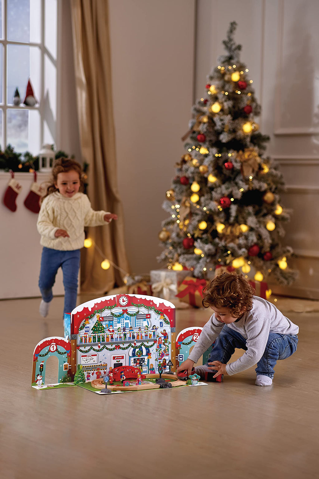 Hape 24 Piece Wooden Christmas Advent Calendar Train Station Set With Decorated Depot Backdrop For Kids, Teens, And Adults, Mult