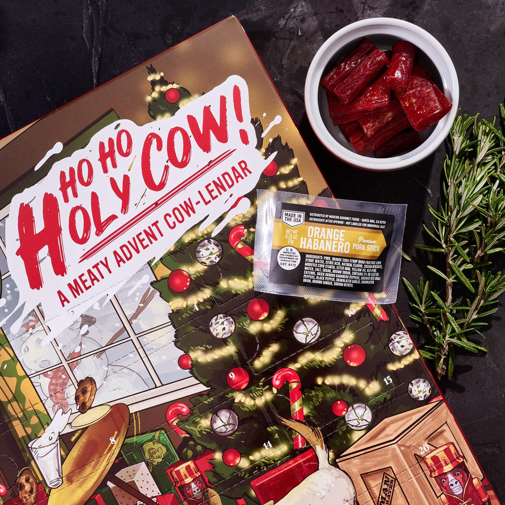Man Crates Jerky Advent Calendar 2024 - 25 Beef Jerky Bites in Red with Ho-Ho-Holy Cow Artwork - Flavors: Orange Habanero, Rootbeer