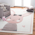 SAFAVIEH Carousel Kids Collection Area Rug - 67 x 9, Ivory & Pink, Bunny Design, Non-Shedding & Easy Care, Ideal for High Traf