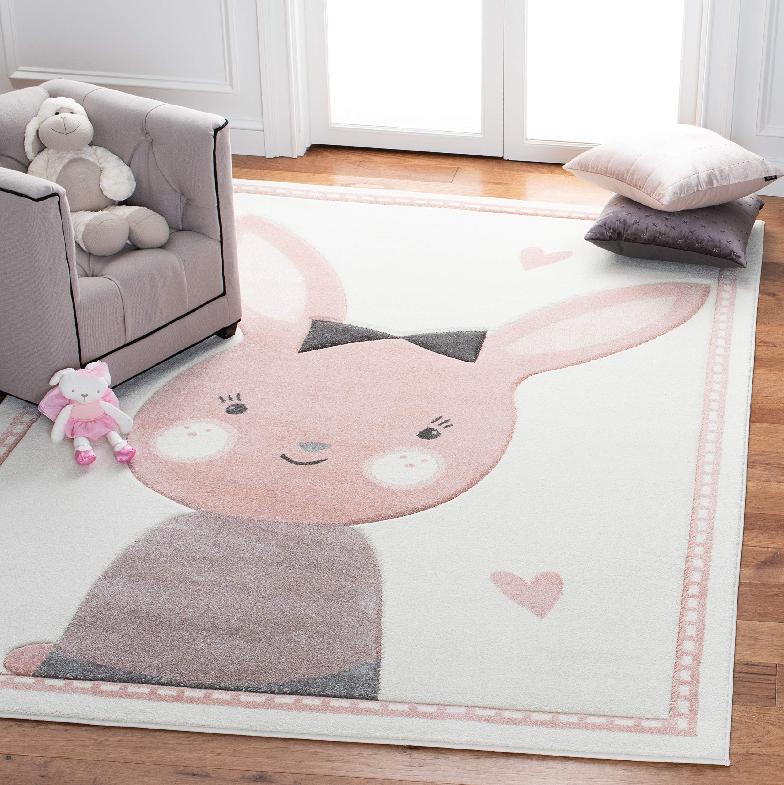 SAFAVIEH Carousel Kids Collection Area Rug - 67 x 9, Ivory & Pink, Bunny Design, Non-Shedding & Easy Care, Ideal for High Traf