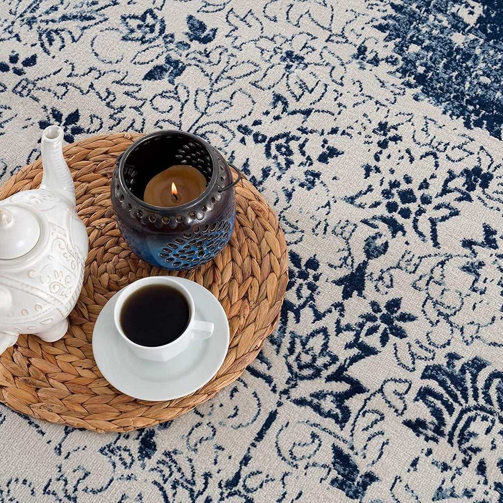 HomeRoots 100% Polypropylene 2’ x 3’ Navy Blue Distressed Floral Scatter Rug