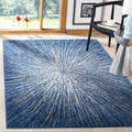 SAFAVIEH Evoke Collection Area Rug - 9 x 12, Navy & Ivory, Abstract Burst Design, Non-Shedding & Easy Care, Ideal for High Tra