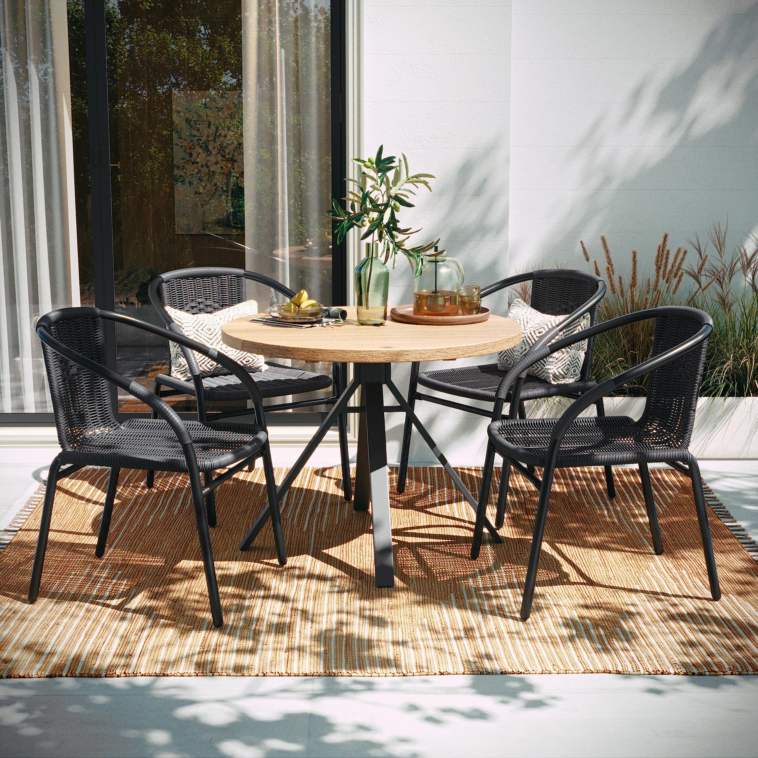 EMMA + OLIVER Set of 4 Modern Rattan Indoor/Outdoor Stack Chairs, Stacking Rattan Patio Chairs with Curved Back and Cross Bracin