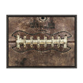 Sylvie Football Laces Framed Canvas by Shawn St. Peter