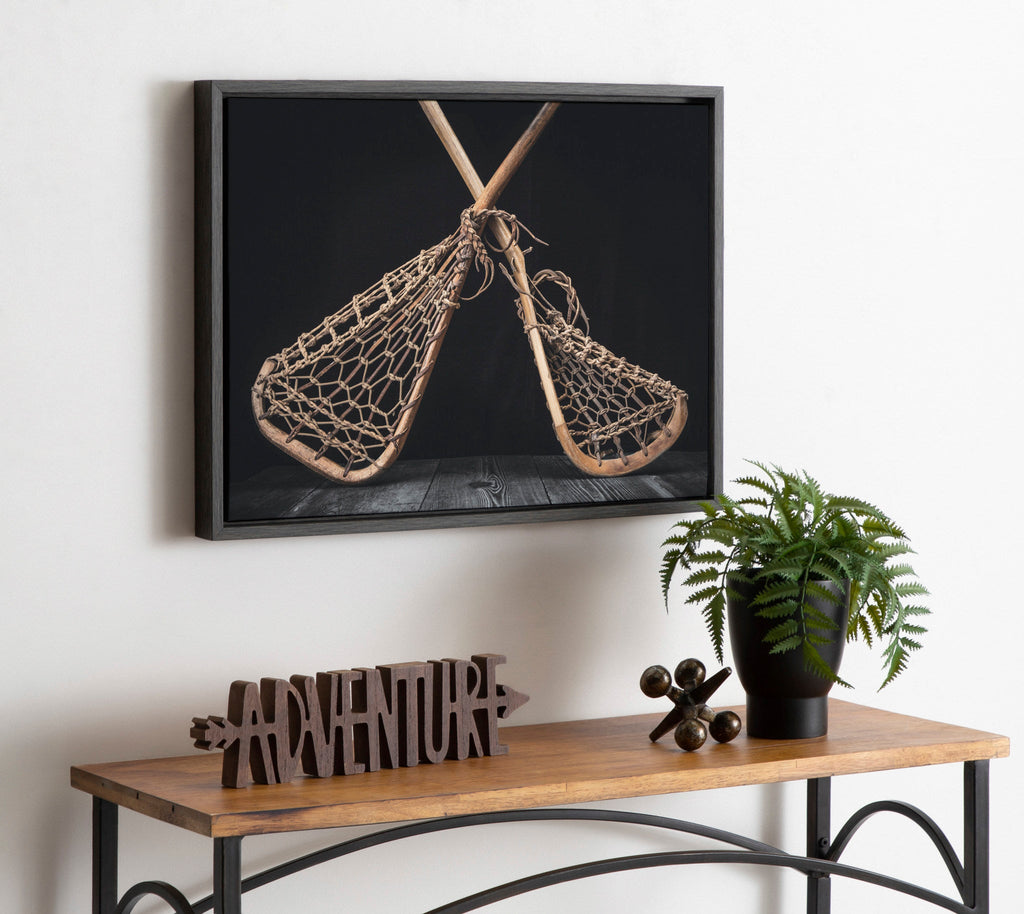 Sylvie Lacrosse Sticks Framed Canvas by Shawn St. Peter