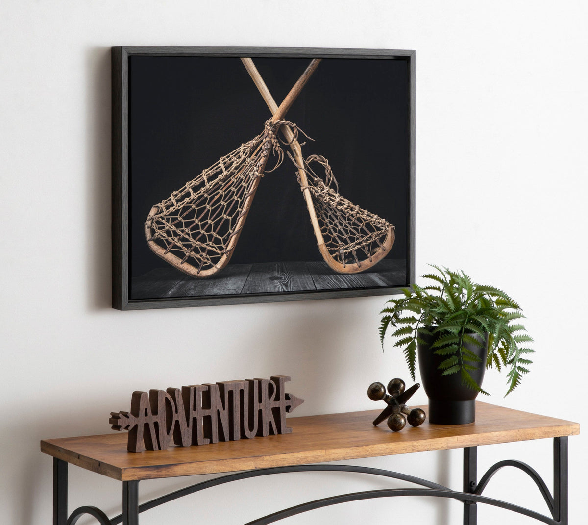 Sylvie Lacrosse Sticks Framed Canvas by Shawn St. Peter