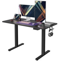Fezibo Height Adjustable Electric Standing Desk, 48 X 24 Inches Stand Up Table, Sit Stand Home Office Desk With Splice Board, Black Frame/Black Top