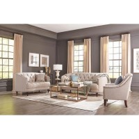 A modern spin on a classic traditional living room collectionSoft, grey linen-like upholsteryButton tufted seat and backrestBeautiful detailed solid wood legs create the perfect foundationThis collection is also available in grey velvet with chrome and si