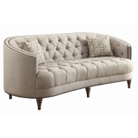 A modern spin on a classic traditional living room collectionSoft, grey linen-like upholsteryButton tufted seat and backrestNailhead trim traces graceful, C-shaped frame on sofa and loveseatBeautiful detailed solid wood legs create the perfect foundationT