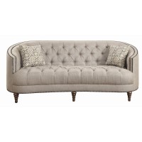 A modern spin on a classic traditional living room collectionSoft, grey linen-like upholsteryButton tufted seat and backrestNailhead trim traces graceful, C-shaped frame on sofa and loveseatBeautiful detailed solid wood legs create the perfect foundationT